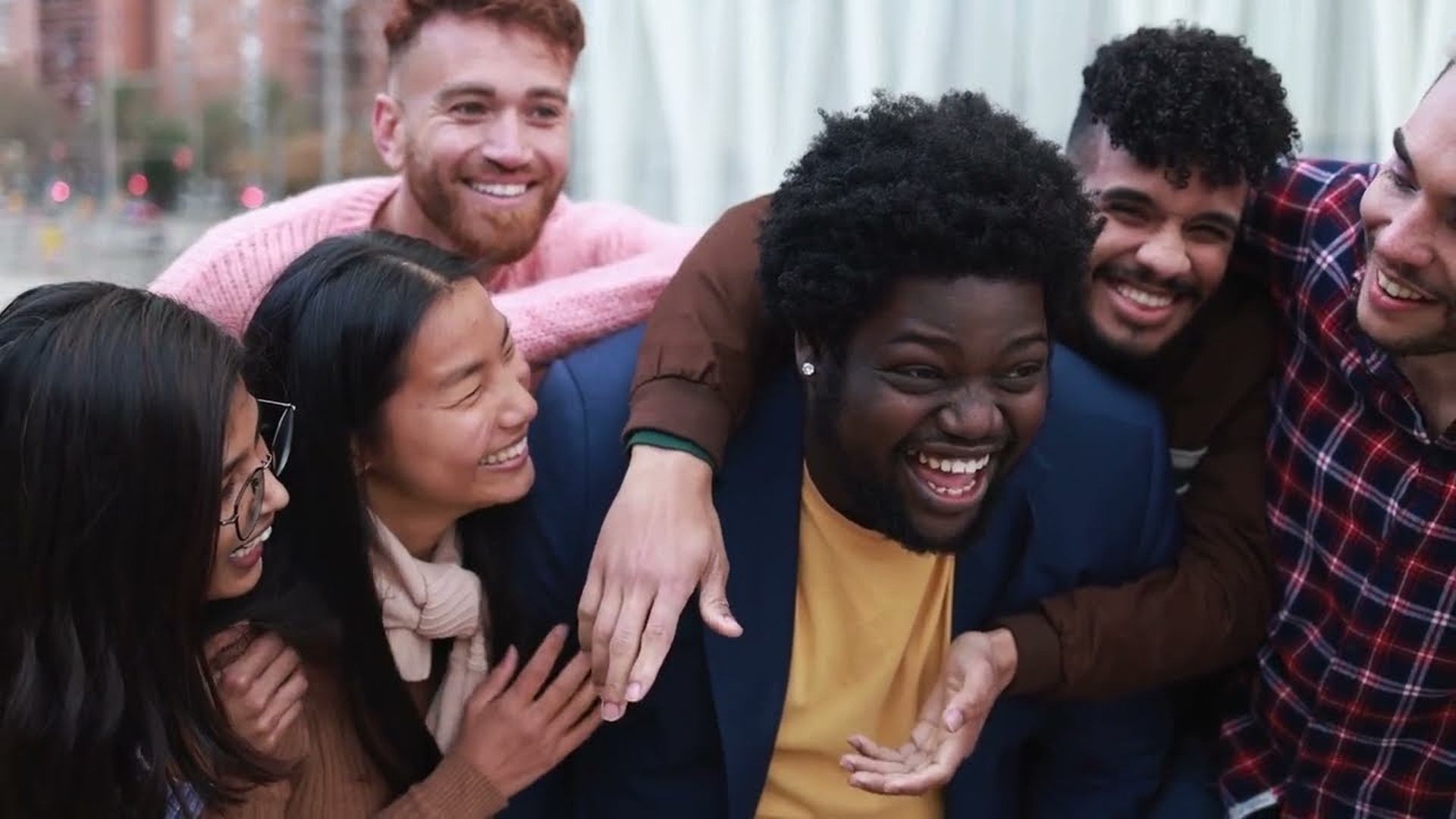 Group of diverse friends laughing together